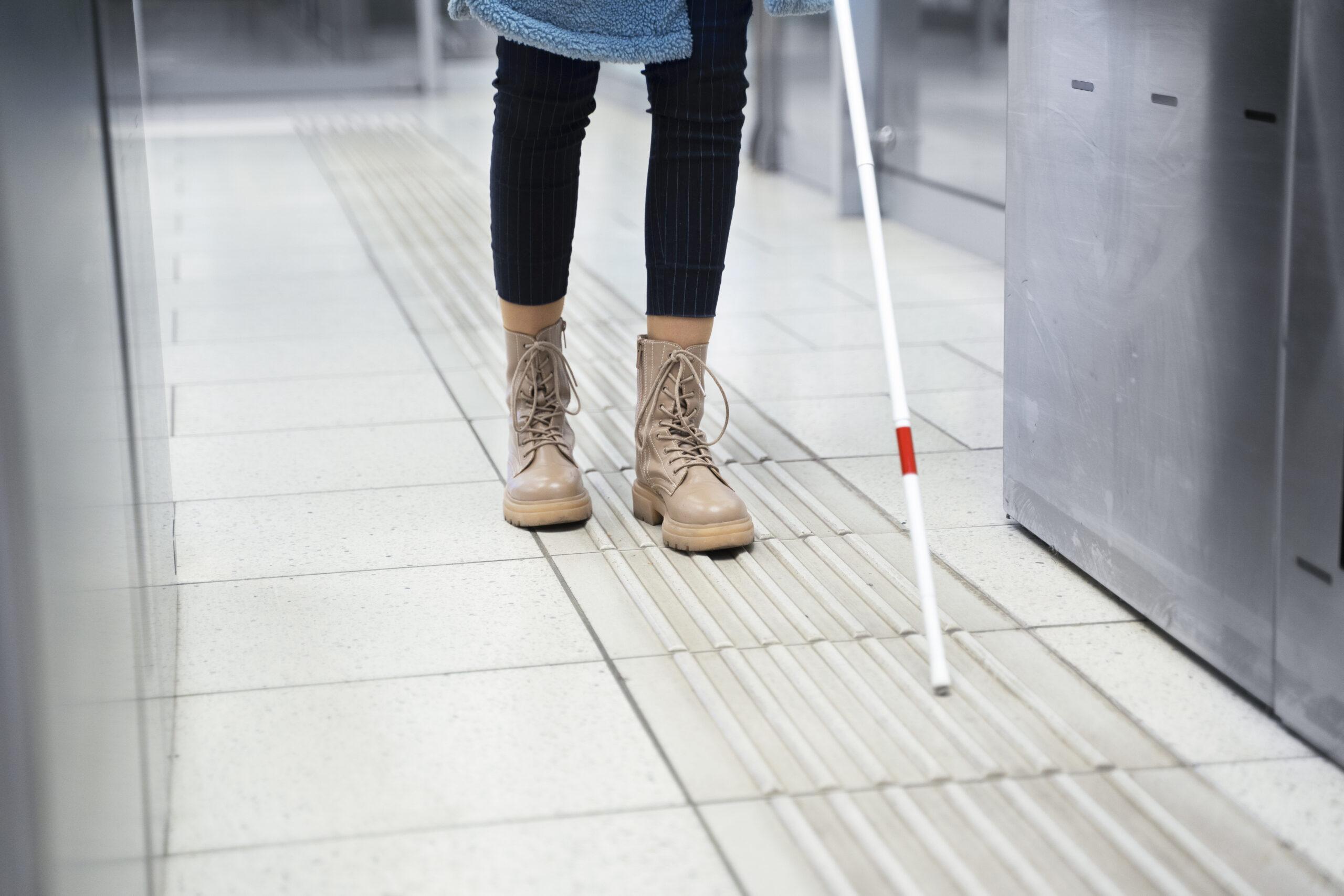 front-view-blind-person-with-white-cane