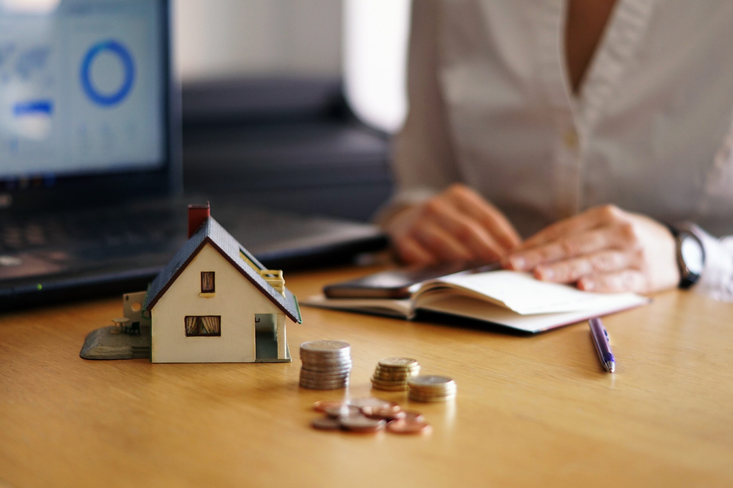 A closeup shot of a person thinking of buying or selling a house